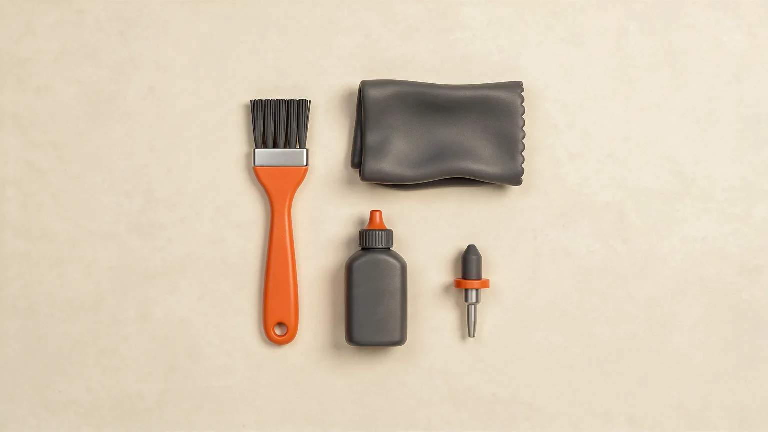 Illustration: a tidy flat-lay of generic 3D printer maintenance tools: a small brush, a cloth, a bottle of lubricant and a spare nozzle, with one orange handle