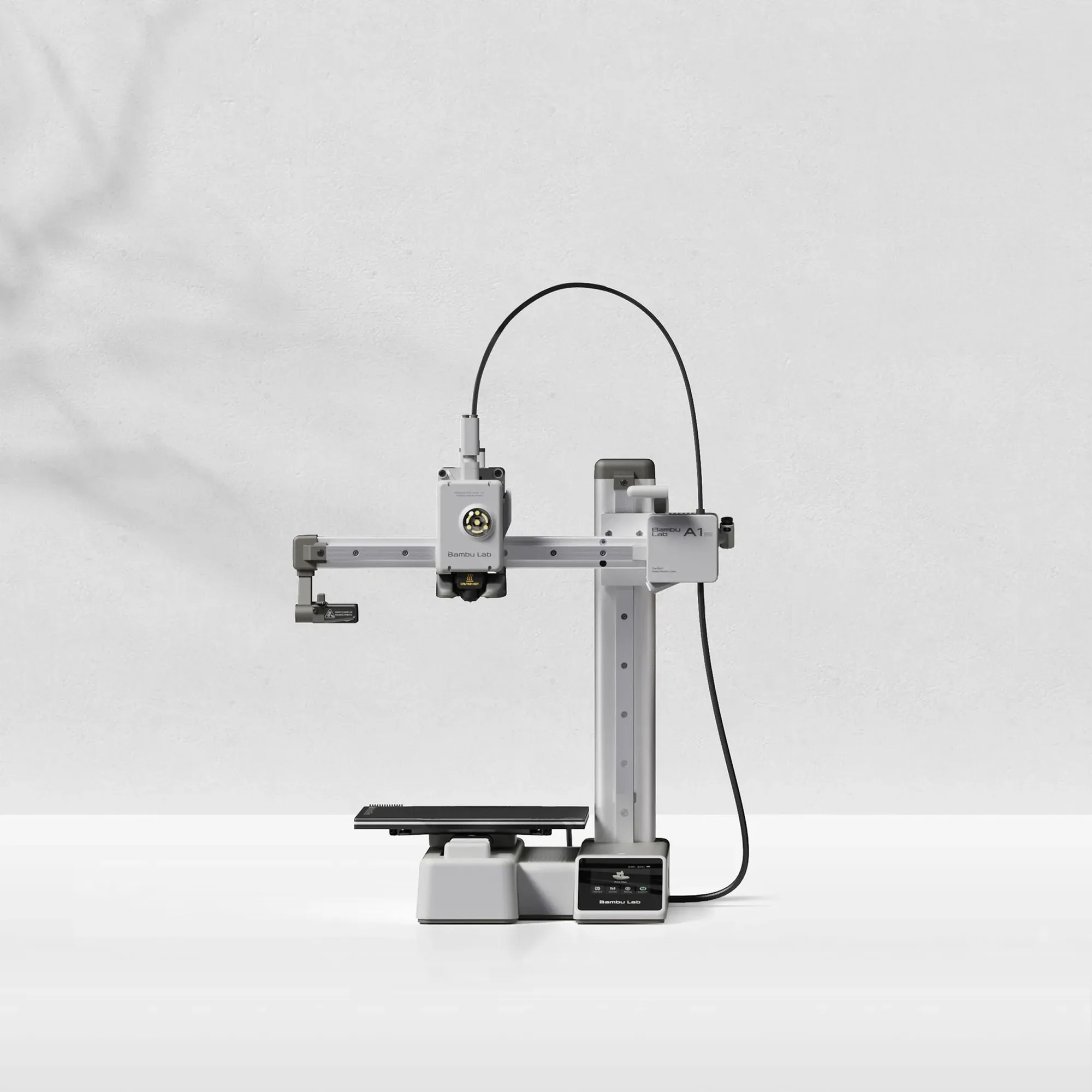 Bambu Lab A1 mini open-frame 3D printer on a light grey background